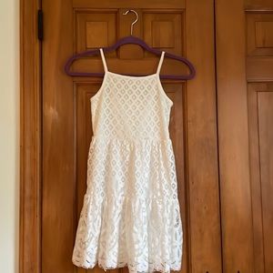 Beautiful white least dress with adjustable straps and zip up back